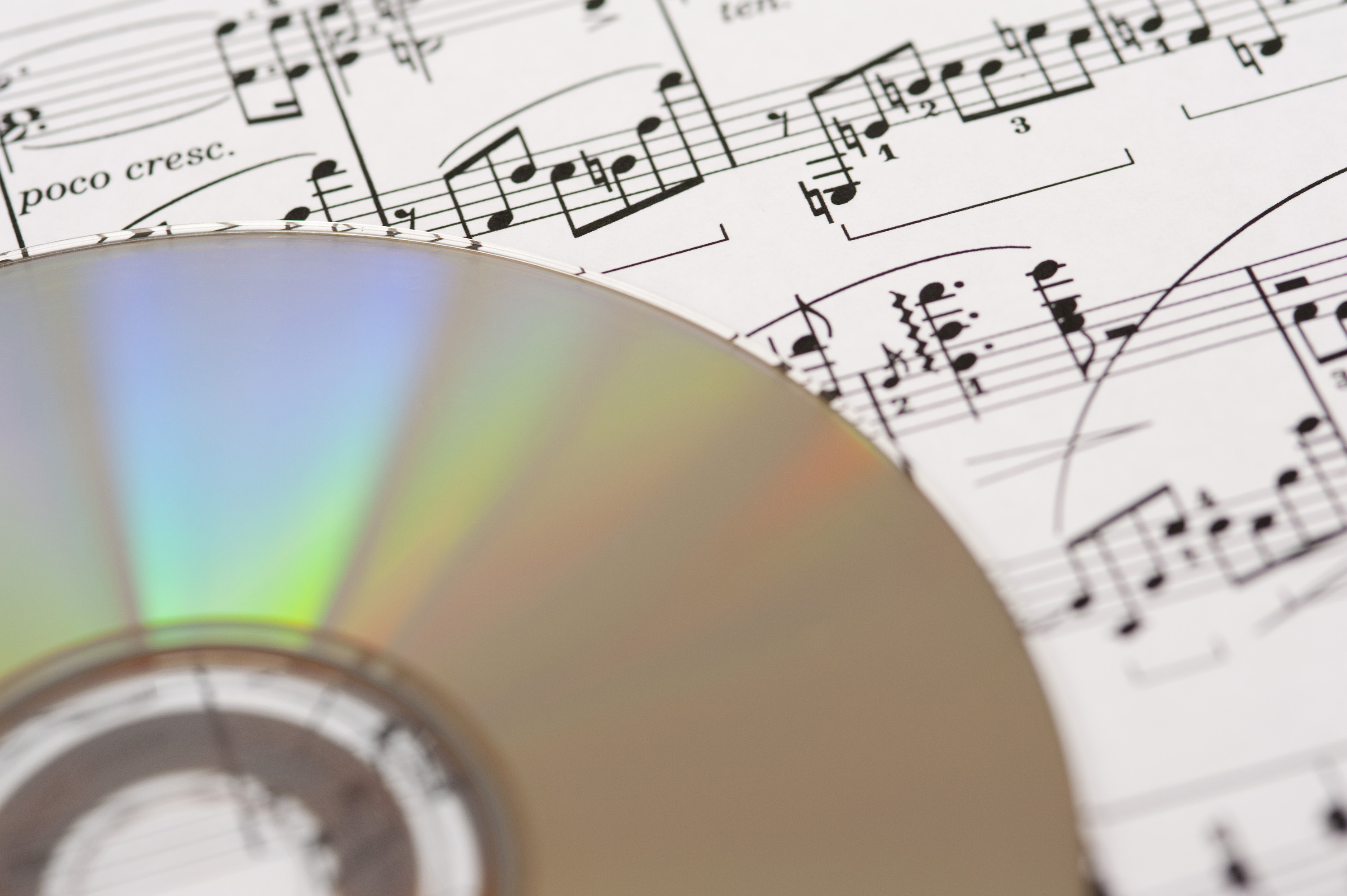 CD on top of sheet music